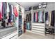 Well-organized walk-in closet featuring shelves, drawers, and hanging rods for ample storage at 9593 Indian Beech Nw Ave, Concord, NC 28027