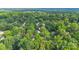 Aerial view of a lush, green neighborhood with tree-lined streets and a canopy of mature trees at 9826 Meringue Pl # 15, Charlotte, NC 28270