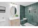 Stylish bathroom with a round mirror, modern vanity, and glass-enclosed shower with built-in bench at 9826 Meringue Pl # 15, Charlotte, NC 28270