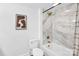 Modern bathroom with stylish marble tile, soaking tub and updated shower hardware at 9826 Meringue Pl # 15, Charlotte, NC 28270
