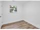 Bright bedroom with hardwood floors, fresh paint, and natural light at 9826 Meringue Pl # 15, Charlotte, NC 28270