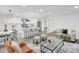 Open-concept living area with a modern kitchen, stylish seating, and plenty of natural light at 9826 Meringue Pl # 15, Charlotte, NC 28270
