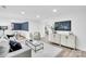 Spacious living room with an open floor plan into the dining area and a stylish decor at 9826 Meringue Pl # 15, Charlotte, NC 28270
