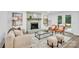 Cozy living room featuring a decorative fireplace, neutral furniture, and French doors to outdoor space at 9826 Meringue Pl # 15, Charlotte, NC 28270