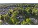 Stunning aerial view of a charming home surrounded by lush greenery and mature trees in a serene neighborhood setting at 1020 12Th Nw Ave, Hickory, NC 28601