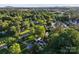Aerial view of a lush, green residential neighborhood with mature trees and well-maintained homes at 1020 12Th Nw Ave, Hickory, NC 28601