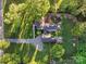 Aerial view of the property showcasing the layout, mature trees and surrounding landscape at 1020 12Th Nw Ave, Hickory, NC 28601