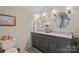 Elegant bathroom with a dual vanity, stylish mirrors, and modern fixtures at 1020 12Th Nw Ave, Hickory, NC 28601