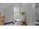 Bright bathroom featuring modern toilet and a window letting in natural light at 1020 12Th Nw Ave, Hickory, NC 28601