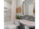 Bathroom with marble tiled shower and stylish pedestal sink at 1020 12Th Nw Ave, Hickory, NC 28601