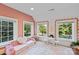 Spacious pink room featuring large windows and cozy seating at 1020 12Th Nw Ave, Hickory, NC 28601