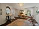 Stylish home office with a desk, chair, mirror, and large area rug at 1020 12Th Nw Ave, Hickory, NC 28601