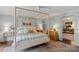 Serene main bedroom with a four-poster bed, soft lighting, and ample space at 1020 12Th Nw Ave, Hickory, NC 28601