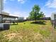 Nice lawn with a wooden fence, mature shade tree, and covered patio, providing a great outdoor space at 10426 Kempsford Dr, Charlotte, NC 28262