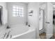 This bathroom features a large soaking tub with jets and a separate glass-enclosed shower at 10426 Kempsford Dr, Charlotte, NC 28262