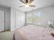 Bedroom features a ceiling fan, neutral walls, and closet, ideal for creating a cozy and comfortable retreat at 10426 Kempsford Dr, Charlotte, NC 28262