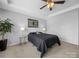 This bedroom has a queen bed with black bedding and a stylish art piece hanging above the headboard at 10426 Kempsford Dr, Charlotte, NC 28262