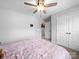 Bedroom with neutral walls, overhead fan and closet, ideal for creating a comfortable and private space at 10426 Kempsford Dr, Charlotte, NC 28262