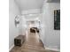 Welcoming entryway boasts wood flooring, neutral walls, and a view into the spacious and inviting living room at 10426 Kempsford Dr, Charlotte, NC 28262