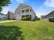 This home offers manicured green lawn, two car garage and a welcoming front porch, perfect for relaxation at 10426 Kempsford Dr, Charlotte, NC 28262