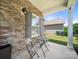 Charming front porch with stone accents, seating area, and natural light at 10426 Kempsford Dr, Charlotte, NC 28262