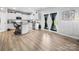 Bright kitchen features white cabinets, stainless steel appliances, an island and a door to the backyard at 10426 Kempsford Dr, Charlotte, NC 28262