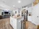 Open concept kitchen featuring a kitchen island and stainless steel appliances at 10426 Kempsford Dr, Charlotte, NC 28262
