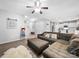 Spacious living area with wood flooring, comfortable sectional, and open layout, ideal for relaxation and social gatherings at 10426 Kempsford Dr, Charlotte, NC 28262