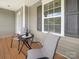 Cozy porch seating area, perfect for enjoying a morning coffee or evening relaxation while viewing the neighbourhood at 10426 Kempsford Dr, Charlotte, NC 28262