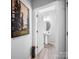 Stylish powder room features a pedestal sink, round mirror, and decorative touches, offering convenience and charm at 10426 Kempsford Dr, Charlotte, NC 28262