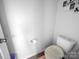 This clean toilet room has a plush toilet seat cover and tiled floors at 10426 Kempsford Dr, Charlotte, NC 28262