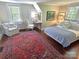 Inviting bedroom features an accent rug, and soft natural light from multiple windows at 1051 14Th Avenue Nw Dr, Hickory, NC 28601