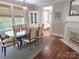 Spacious dining room with a fireplace, hardwood floors, and a view into the kitchen at 1051 14Th Avenue Nw Dr, Hickory, NC 28601