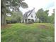 Charming two-story home featuring a well-manicured lawn and traditional architectural details at 1051 14Th Avenue Nw Dr, Hickory, NC 28601