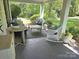 Inviting covered front porch with comfortable seating and stylish outdoor decor creating a cozy atmosphere at 1051 14Th Avenue Nw Dr, Hickory, NC 28601