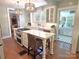 Stylish kitchen with a center island, seating, stainless appliances, and a view to a sunny breakfast nook at 1051 14Th Avenue Nw Dr, Hickory, NC 28601
