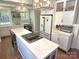 Bright, updated kitchen with white cabinets, stainless steel appliances, and a spacious island at 1051 14Th Avenue Nw Dr, Hickory, NC 28601