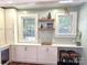 Butlers pantry complete with bar stool seating and ample storage at 1051 14Th Avenue Nw Dr, Hickory, NC 28601