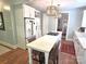 Bright kitchen with a large island, white cabinetry, stainless steel appliances, and lovely pendant lighting at 1051 14Th Avenue Nw Dr, Hickory, NC 28601