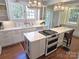 Modern kitchen featuring white cabinetry, stainless steel appliances, a large sink, and a center island at 1051 14Th Avenue Nw Dr, Hickory, NC 28601