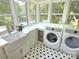 Efficient laundry room with a sink, counter space, and washer and dryer hookups at 1051 14Th Avenue Nw Dr, Hickory, NC 28601