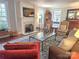 Inviting living room features a fireplace, large windows, and comfortable seating arrangement at 1051 14Th Avenue Nw Dr, Hickory, NC 28601