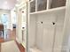 Well-organized mudroom featuring cubbies, hooks, and a bench with storage at 1051 14Th Avenue Nw Dr, Hickory, NC 28601
