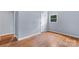 Bedroom featuring hard surface floors, neutral paint, and natural light at 1075 Parkview Dr, Gastonia, NC 28054