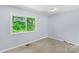 Bedroom featuring hard surface floors, neutral paint, and natural light at 1075 Parkview Dr, Gastonia, NC 28054