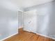 Bedroom featuring hardwood floors and a closet at 1075 Parkview Dr, Gastonia, NC 28054