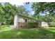 Cozy single-Gathering home with lush greenery, brick accents, and manicured lawn at 1075 Parkview Dr, Gastonia, NC 28054