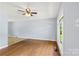 Bright living room featuring hardwood floors, neutral walls, and a large window at 1075 Parkview Dr, Gastonia, NC 28054