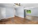 Bright living room featuring hardwood floors, neutral walls, and open access to other areas at 1075 Parkview Dr, Gastonia, NC 28054