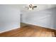 Bright living room featuring hardwood floors, neutral walls, and a ceiling fan at 1075 Parkview Dr, Gastonia, NC 28054